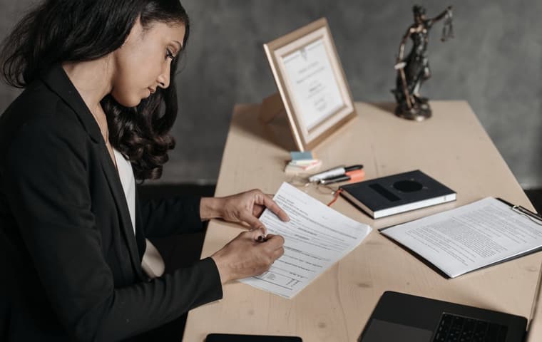 Illustrative stock photograph of a lawyer reading paperwork